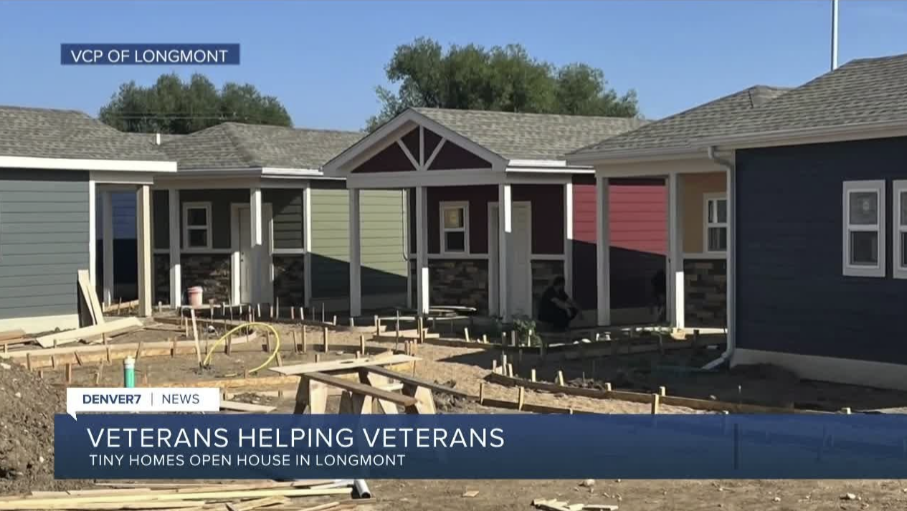 Newly built tiny homes for veterans at an open house